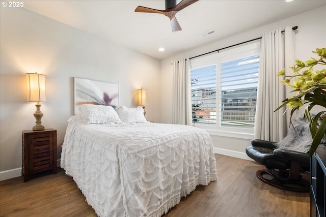 bedroom featuring visible vents, ceiling fan, baseboards, recessed lighting, and wood finished floors