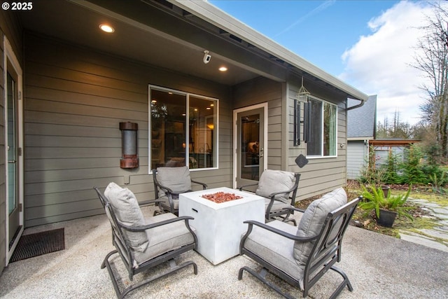 view of patio with a fire pit