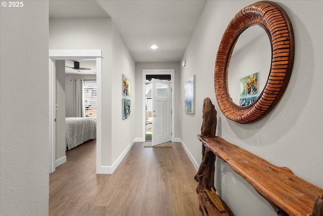 foyer with recessed lighting, wood finished floors, baseboards, and ceiling fan