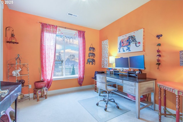 office space featuring a wealth of natural light and carpet floors