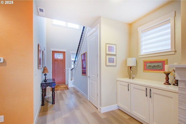 hall with light hardwood / wood-style flooring