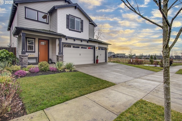 view of front of house with a lawn and a garage