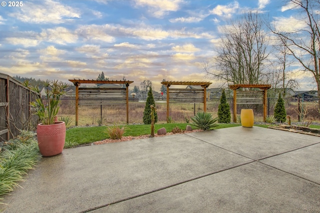 patio terrace at dusk with a pergola