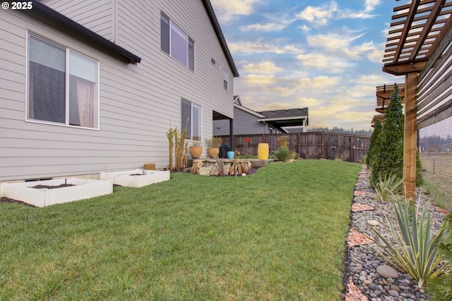 view of yard at dusk