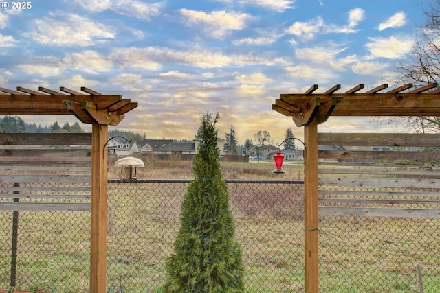 view of yard at dusk