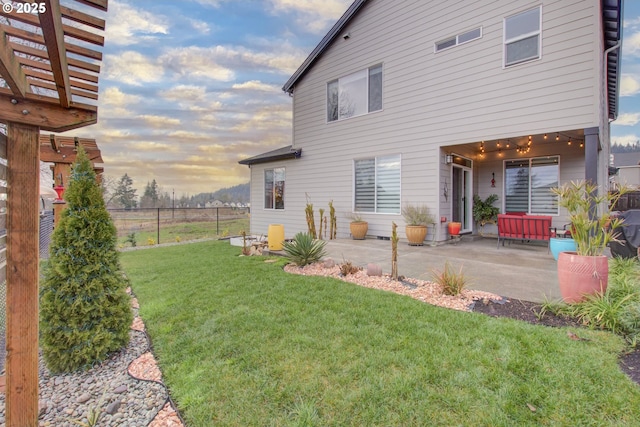 exterior space with a lawn and a patio