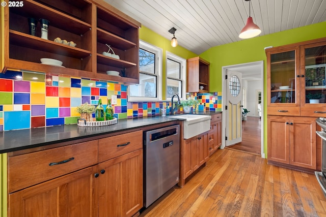 kitchen featuring hanging light fixtures, stainless steel dishwasher, brown cabinets, open shelves, and dark countertops