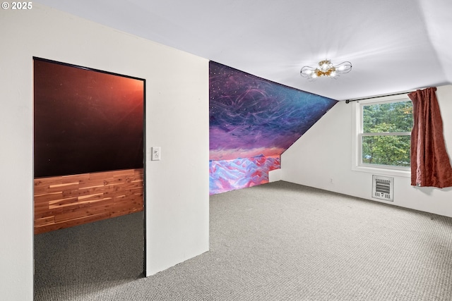 bonus room featuring vaulted ceiling and carpet flooring