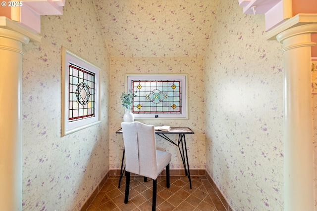 tiled home office featuring ornate columns, baseboards, and wallpapered walls