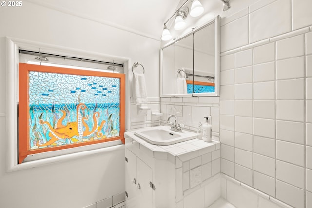 bathroom featuring tasteful backsplash and vanity