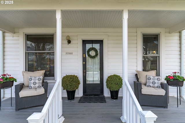 entrance to property featuring a porch