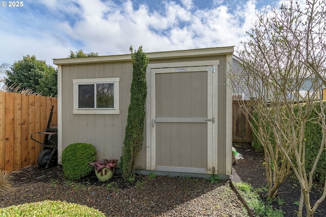 view of shed featuring a fenced backyard