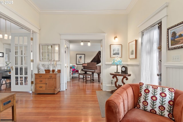 living room featuring wood finished floors and ornamental molding