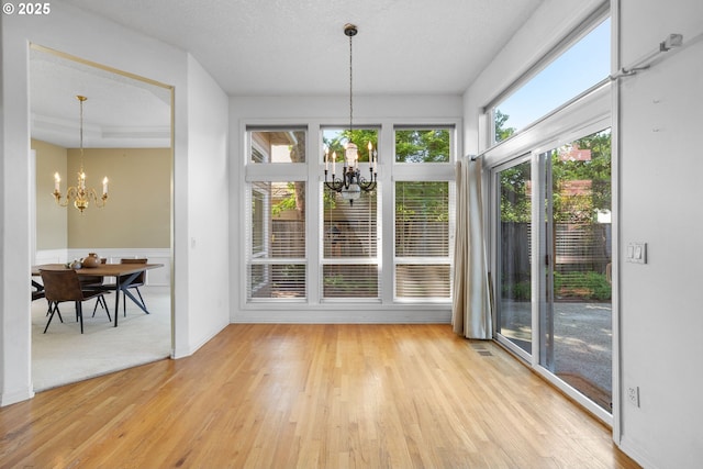 dining space with a chandelier and light wood-style flooring