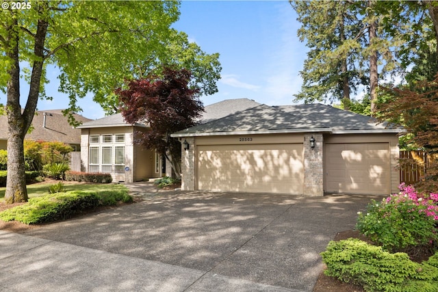 view of front of property featuring concrete driveway, brick siding, and an attached garage