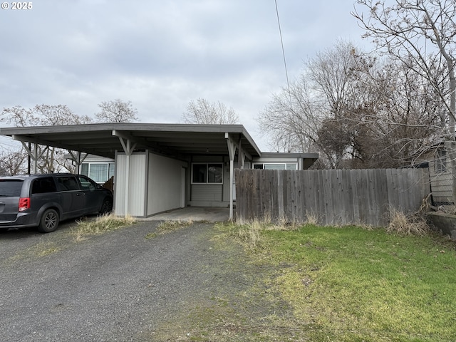 exterior space with a carport