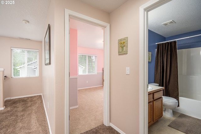 5761 Mt Vernon Rd, Springfield, OR 97478 - hall featuring light carpet, baseboards, and a textured ceiling