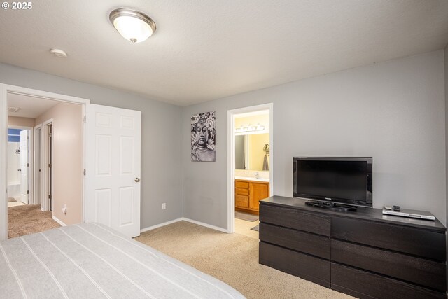 5761 Mt Vernon Rd, Springfield, OR 97478 - bedroom featuring light colored carpet, ensuite bathroom, baseboards, and a sink