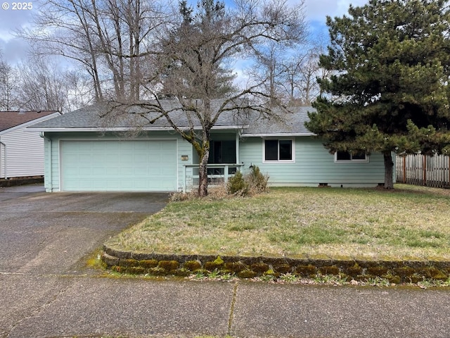 ranch-style home featuring aphalt driveway, an attached garage, fence, and a front yard