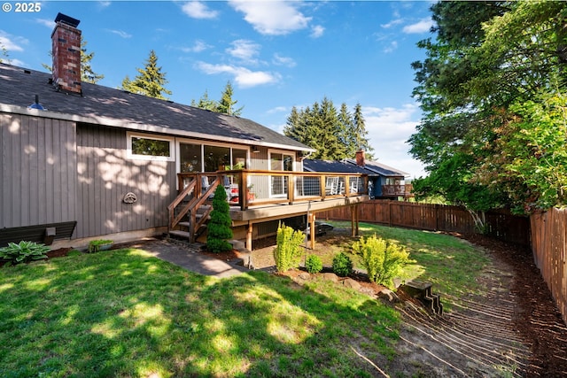 7780 Blinkhorn Way, Gladstone, OR 97027 - back of house featuring a fenced backyard, a wooden deck, and a chimney