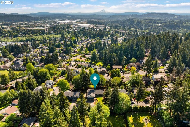 7780 Blinkhorn Way, Gladstone, OR 97027 - aerial overview of property's location featuring a mountainous background and nearby suburban area