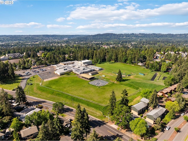 7780 Blinkhorn Way, Gladstone, OR 97027 - aerial perspective of suburban area with a heavily wooded area