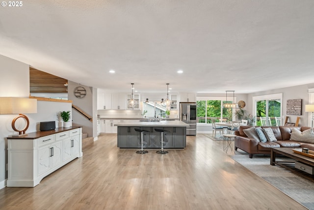 7780 Blinkhorn Way, Gladstone, OR 97027 - living room with light wood-style flooring and recessed lighting