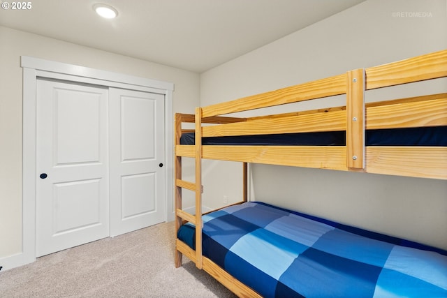 carpeted bedroom with a closet