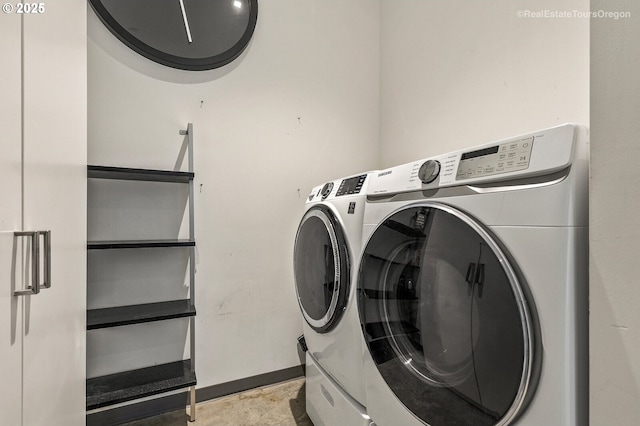 washroom featuring washer and dryer