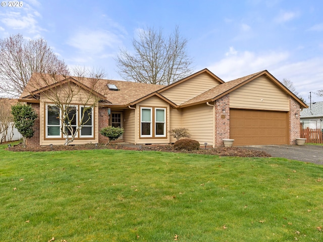 ranch-style home with brick siding, a garage, driveway, and a front yard