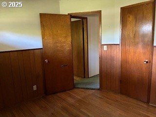14031 SE Rhone St, Portland, OR 97236 - corridor featuring wood finished floors and wood walls