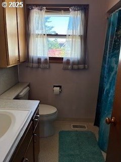 14031 SE Rhone St, Portland, OR 97236 - bathroom with vanity, toilet, and a shower with shower curtain