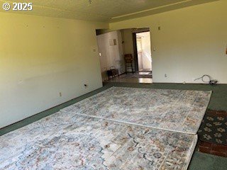 14031 SE Rhone St, Portland, OR 97236 - unfurnished living room featuring carpet flooring
