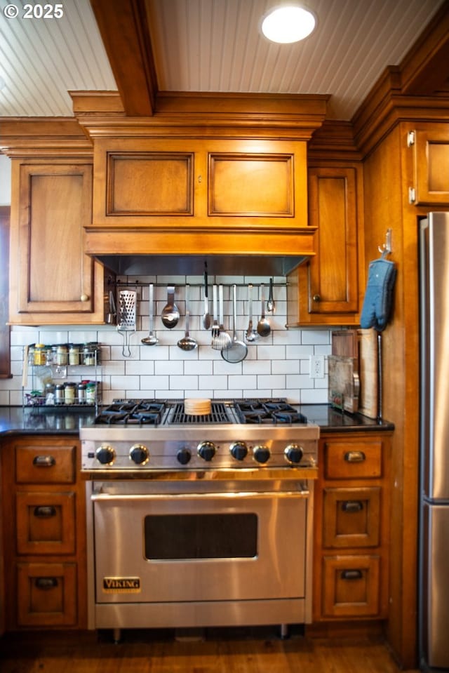 62725 Eagle Rd, Bend, OR 97701 - kitchen with dark countertops, brown cabinets, wooden ceiling, backsplash, and stainless steel appliances