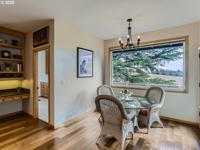 dining space with a healthy amount of sunlight, light wood finished floors, and baseboards