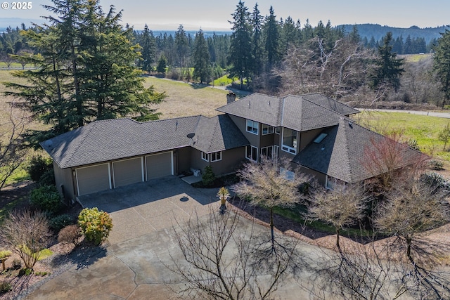 birds eye view of property with a forest view