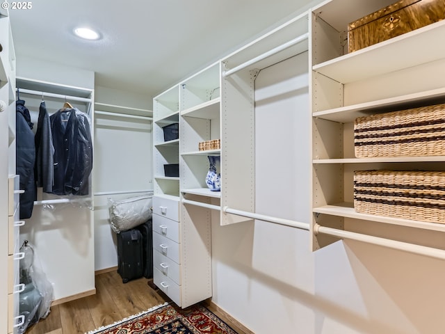 spacious closet with wood finished floors