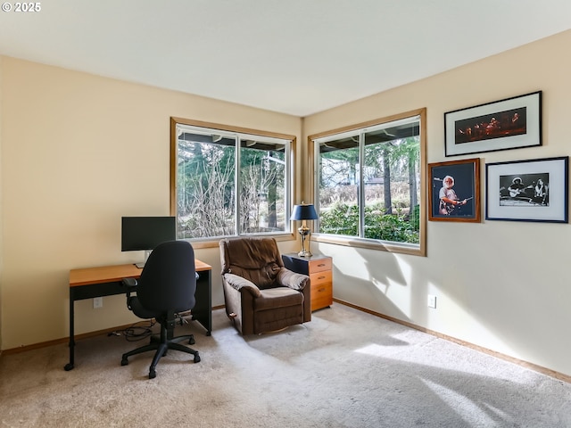 home office featuring light carpet and baseboards