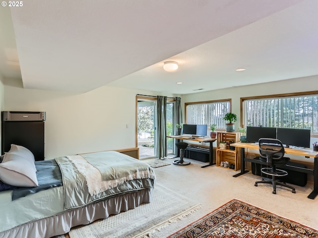 carpeted bedroom featuring access to outside