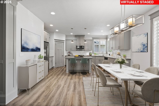 14716 Blue Blossom Way, Oregon City, OR 97045 - dining space featuring light wood-style flooring and recessed lighting