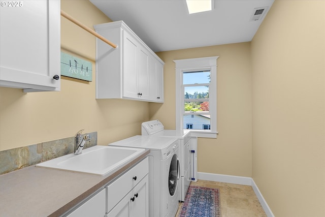 2121 Ostman Rd, West Linn, OR 97068 - laundry room with cabinet space, separate washer and dryer, and baseboards