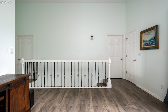 18576 SW Tara Meadows Ct, Beaverton, OR 97078 - hallway with an upstairs landing, a high ceiling, wood finished floors, and radiator