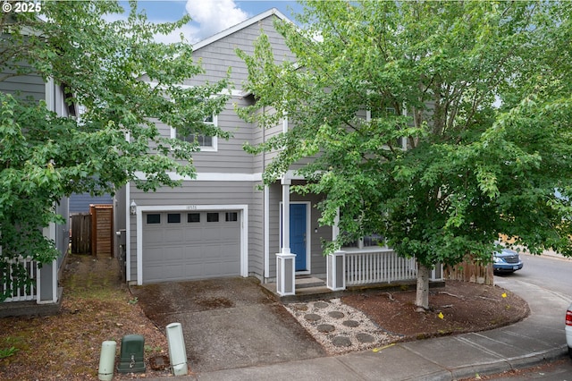 18576 SW Tara Meadows Ct, Beaverton, OR 97078 - view of front of house with driveway, a garage, and covered porch