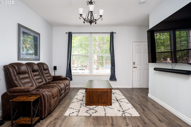 18576 SW Tara Meadows Ct, Beaverton, OR 97078 - living area with dark wood-style flooring and a chandelier