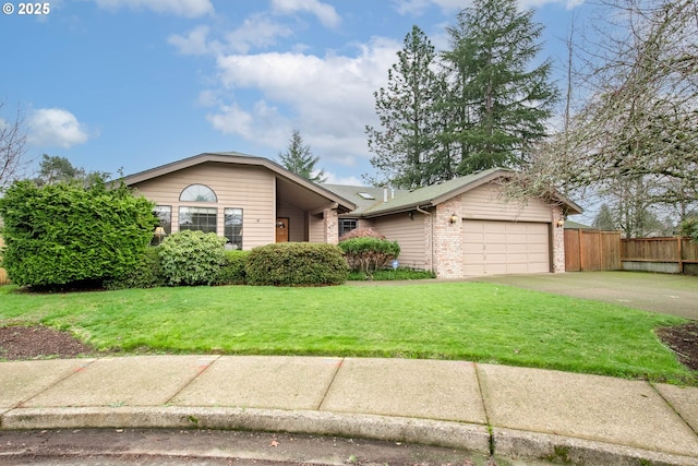 view of front of house featuring a garage and a front lawn