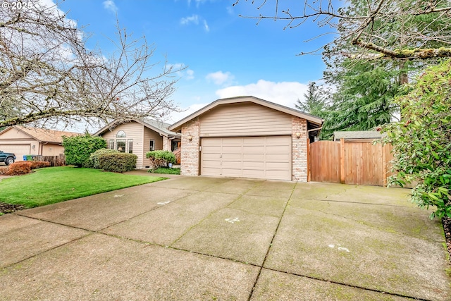 ranch-style home with a garage and a front lawn