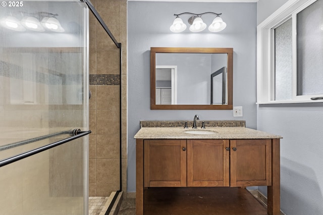 bathroom with vanity and an enclosed shower