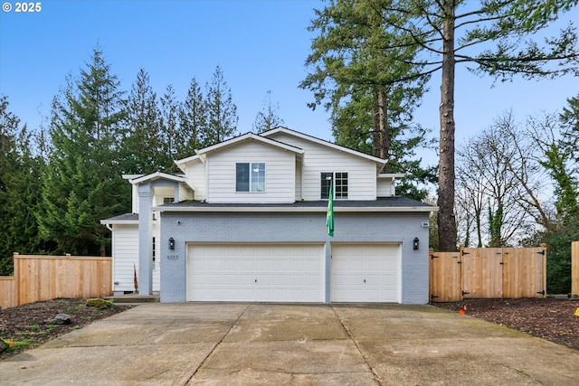 traditional-style house with a garage, brick siding, fence, and driveway