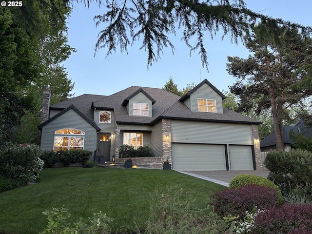 342 NW 84th Pl, Portland, OR 97229 - traditional-style house with a front yard, a garage, driveway, brick siding, and roof with shingles