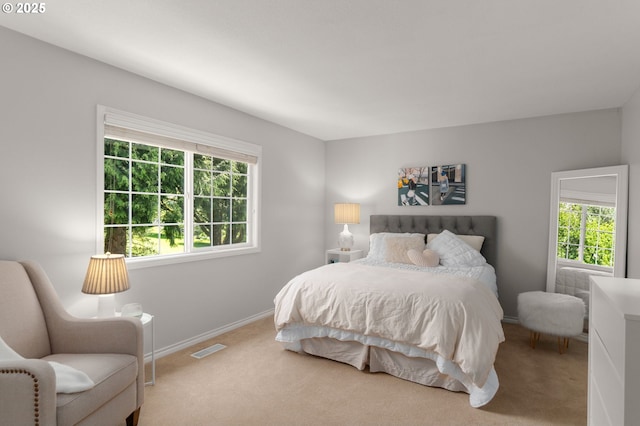 342 NW 84th Pl, Portland, OR 97229 - carpeted bedroom featuring multiple windows and baseboards